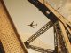 airplane viewed through bridge structure