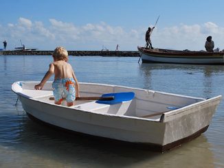 child on a small boat