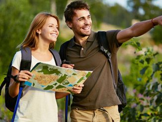 Couple Of Hikers In The Countryside At Summer