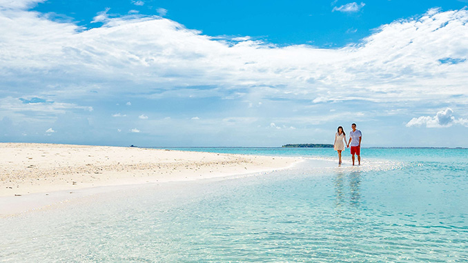 couple walking on a beach