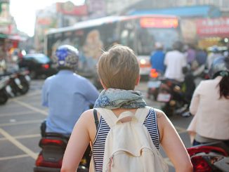 lone woman traveler city downtown