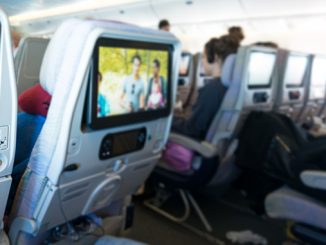 People on board looking at seat monitors