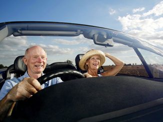 senior couple traveling in the car