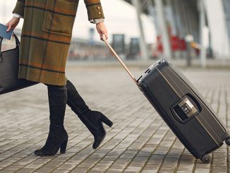 woman with travel bag at the airport